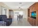 Inviting dining area featuring tiled flooring, ceiling fan, and sliding door to patio at 1054 Embassy Ave, Spring Hill, FL 34606