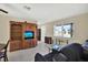 Cozy living room with tile flooring, neutral walls, and comfortable seating at 1054 Embassy Ave, Spring Hill, FL 34606