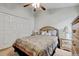 Bedroom with neutral walls, a ceiling fan, and a comfortable bed with decorative pillows at 12004 Valley Falls Loop, Spring Hill, FL 34609