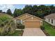 Attractive single-Gathering home featuring a two-car garage and appealing landscaping at 12004 Valley Falls Loop, Spring Hill, FL 34609