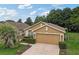 Charming single-story home featuring a two-car garage, well-manicured landscaping, and inviting curb appeal at 12004 Valley Falls Loop, Spring Hill, FL 34609