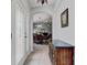 Welcoming entryway with tiled flooring, complemented by a decorative door and neutral paint at 12004 Valley Falls Loop, Spring Hill, FL 34609