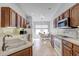 Bright kitchen with wood cabinets, complete appliances, and breakfast nook with backyard view, creating a cozy space at 12004 Valley Falls Loop, Spring Hill, FL 34609