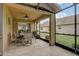 Covered patio area, perfect for outdoor entertaining with ceiling fan and screened in views at 12004 Valley Falls Loop, Spring Hill, FL 34609