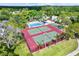 Aerial view of tennis courts showcasing the recreational amenities of the community at 1202 Forestwood Dr, Oldsmar, FL 34677