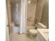 Bathroom shower and tub with safety features and neutral tile at 12119 Sunny Glen Ln # G2, Hudson, FL 34669