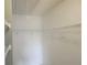 Spacious walk-in closet featuring wire shelving and hanging space at 12119 Sunny Glen Ln # G2, Hudson, FL 34669