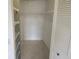 Bedroom closet with ventilated doors, wire shelves and hanging racks at 12119 Sunny Glen Ln # G2, Hudson, FL 34669