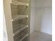 Walk-in closet with adjustable wire shelving for optimal storage organization at 12119 Sunny Glen Ln # G2, Hudson, FL 34669