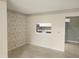 View from living room of kitchen, highlighting modern appliances and ample counter space at 12119 Sunny Glen Ln # G2, Hudson, FL 34669