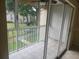 Enclosed porch with tiled floor and sliding glass doors offering views of the outdoors at 12119 Sunny Glen Ln # G2, Hudson, FL 34669
