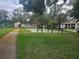 Shuffleboard courts offer a fun recreational activity, surrounded by lush greenery and benches at 12119 Sunny Glen Ln # G2, Hudson, FL 34669