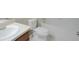Clean bathroom featuring white sink, cabinets, and tub at 12714 Saulston Pl, Hudson, FL 34669
