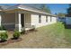 Charming single-story home with a well-manicured front lawn and landscaping at 12714 Saulston Pl, Hudson, FL 34669
