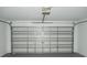 Attached garage with metal door at 12714 Saulston Pl, Hudson, FL 34669