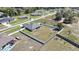 Overhead view capturing the home's backyard, neighboring houses, and residential setting at 12848 Hilary St, Spring Hill, FL 34609
