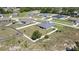 Aerial view highlights a home with a large lot, privacy fence, and proximity to amenities at 12848 Hilary St, Spring Hill, FL 34609