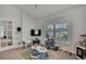Bedroom featuring a large window, neutral walls, and carpeted flooring at 12848 Hilary St, Spring Hill, FL 34609