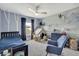 Playful bedroom with a mountain mural, tent, cozy seating, and ample natural light at 12848 Hilary St, Spring Hill, FL 34609