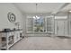 Dining room featuring large windows, shutters, neutral paint, and elegant chandelier at 12848 Hilary St, Spring Hill, FL 34609