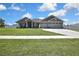 Beautiful one story house with well-kept lawn, three-car garage and traditional curb appeal at 12848 Hilary St, Spring Hill, FL 34609