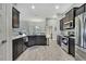 Beautiful kitchen with stainless steel appliances, granite countertops, and access to a dining area at 12848 Hilary St, Spring Hill, FL 34609