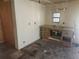 A dated kitchen space featuring an outdated sink and cabinetry in need of renovation at 13120 Davista Ave, New Port Richey, FL 34654