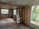 View of a room under renovation with a hot water heater and open ceiling at 13120 Davista Ave, New Port Richey, FL 34654