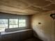 A view of a room showing built-in cabinetry under a set of windows at 13120 Davista Ave, New Port Richey, FL 34654