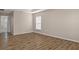 This bedroom has wood-look floors and an ensuite bathroom at 13619 Hunters Point St, Spring Hill, FL 34609