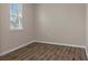 A small bedroom with wood-look floors at 13619 Hunters Point St, Spring Hill, FL 34609