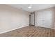 Bedroom with wood-look floors, neutral walls, and a ceiling fan at 13619 Hunters Point St, Spring Hill, FL 34609