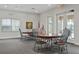 Clubhouse room featuring round tables, chairs, and an American flag for gatherings and events at 13619 Hunters Point St, Spring Hill, FL 34609