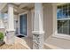 Elegant front door entry with stone accents and well-maintained landscaping at 13619 Hunters Point St, Spring Hill, FL 34609
