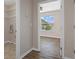 A hallway with a view into another room at 13619 Hunters Point St, Spring Hill, FL 34609