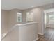 Hallway featuring wood floors and access to other rooms at 13619 Hunters Point St, Spring Hill, FL 34609