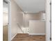 Upstairs hallway with wood-look floors, neutral paint, and a staircase leading down to the main level at 13619 Hunters Point St, Spring Hill, FL 34609
