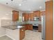 Spacious kitchen with granite countertops, breakfast bar and stainless appliances at 13619 Hunters Point St, Spring Hill, FL 34609