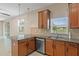 Cozy living room featuring a granite countertop and wood cabinets at 13619 Hunters Point St, Spring Hill, FL 34609