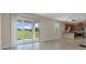 Living room with access to the kitchen and an outdoor patio at 13619 Hunters Point St, Spring Hill, FL 34609