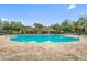 Large community pool featuring clear blue water, ample space for swimming, and beautiful landscaping at 13619 Hunters Point St, Spring Hill, FL 34609