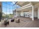 Multi-level brick patio with outdoor furniture, hot tub, and wet bar overlooking the water at 1473 Sail Harbor Cir, Tarpon Springs, FL 34689