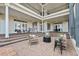Multi-tiered brick patio with bar area, fire pit, and seating on waterfront property at 1473 Sail Harbor Cir, Tarpon Springs, FL 34689