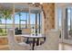 Bright breakfast nook featuring a water view and comfortable seating at 1473 Sail Harbor Cir, Tarpon Springs, FL 34689
