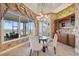 Elegant dining area with a water view, featuring luxury finishes, chandelier, and natural light at 1473 Sail Harbor Cir, Tarpon Springs, FL 34689