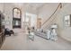 Bright and spacious living room with open floor plan and decorative wall paper, seamlessly blending style and comfort at 1473 Sail Harbor Cir, Tarpon Springs, FL 34689