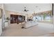 Spacious living room features custom built-ins, a fireplace, and scenic water views at 1473 Sail Harbor Cir, Tarpon Springs, FL 34689