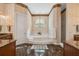 Luxurious main bathroom featuring a soaking tub and elegant finishes at 1473 Sail Harbor Cir, Tarpon Springs, FL 34689