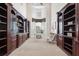 Spacious office features custom built-in bookshelves, large window, and neutral color scheme at 1473 Sail Harbor Cir, Tarpon Springs, FL 34689