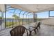 Beautiful enclosed patio with tile flooring, a ceiling fan and open views to the water at 1473 Sail Harbor Cir, Tarpon Springs, FL 34689
